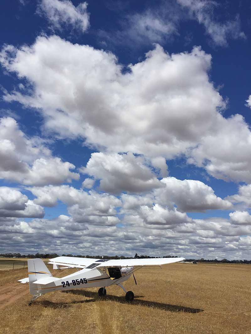 Bendigo GC Eurofox towplane under a cumulus laden sky