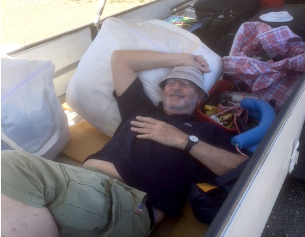 Michael takes a rest from the heat in the trailer.